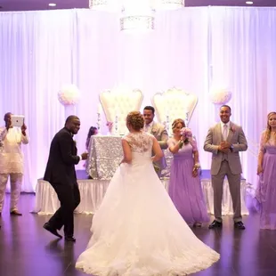 a bride and groom having their first dance