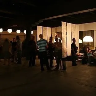 a group of people standing and sitting
