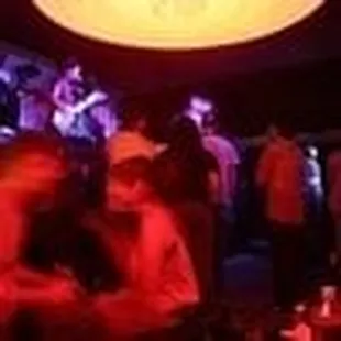 a group of people sitting at a bar