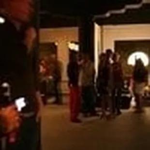 a group of people standing in a hall