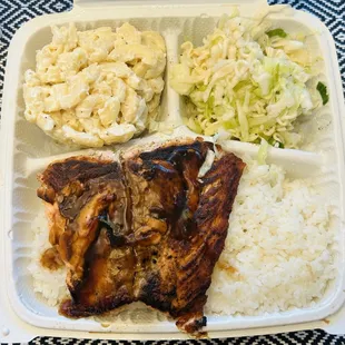 Salmon teriyaki platter with rice, cabbage salad, and macaroni salad