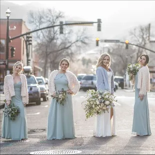 bridesmaids and bridesmaids standing in the street