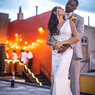 Bride and groom on roof near rear entrance to Loft Music Venue