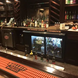 a bar with several bottles of alcohol