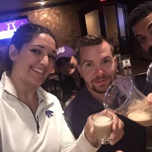a man and a woman drinking beer