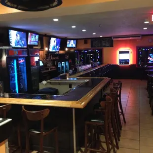 Behind me is two dartboards, brand new bathrooms, and an inclosed smoking room convenient for smokers and non smokers.