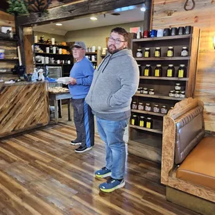two men standing in a store