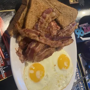 bacon, eggs, and toast on a plate