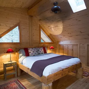 King sized hand made bed in the master loft...