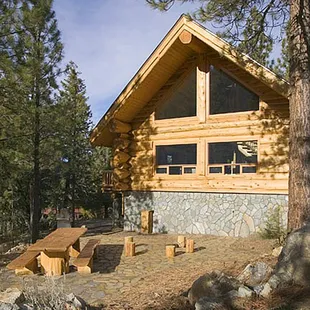 Large hand carved table on stone patio...