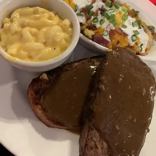 Bacon wrapped bison meatloaf with Mac and cheese and loaded mashed potatoes.