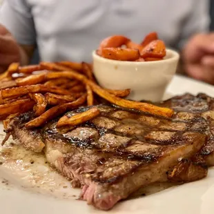 Ribeye with sweet potato fries and carrots