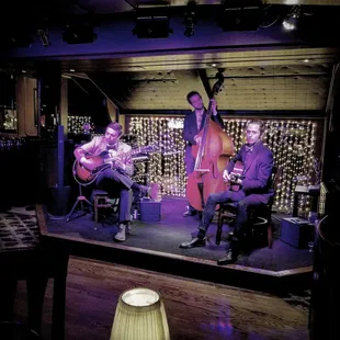 a group of musicians playing on stage