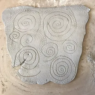 A carved wall hanging by Deb