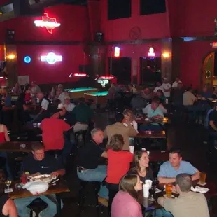 a large group of people sitting at tables