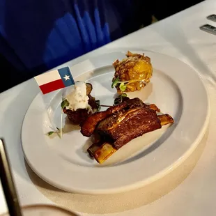 Wild boar ribs, rattlesnake/rabbit sausage and lobster hush puppy.