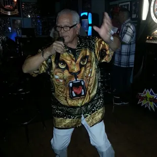 a man in a tiger shirt dancing