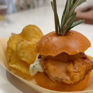 Paner salmon bites with a dill relish aïoli, glazed, pineapple and sesame kettle chips