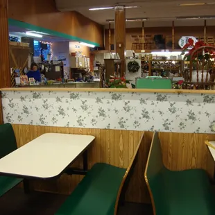 Ice cream parlor seating and view towards the front desk &amp; checkout area.