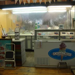 Ice cream parlor in front, on the right (north) side.