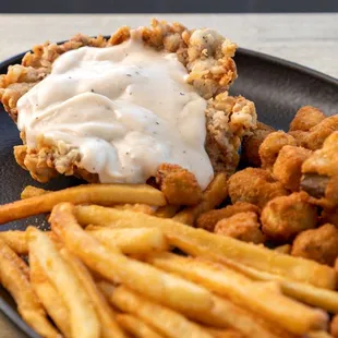 a plate of fried chicken and fries