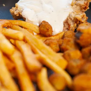 a plate of fried chicken and french fries
