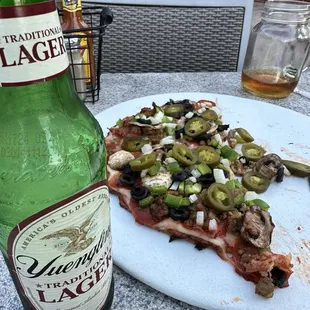 Cold beer and pizza.