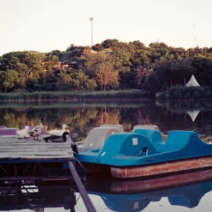 a row of boats on a lake