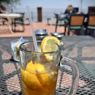 a glass of lemonade on a table
