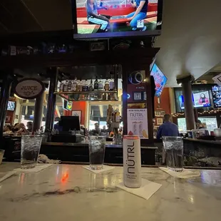 a television on the bar