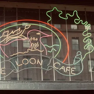 a neon sign in a window