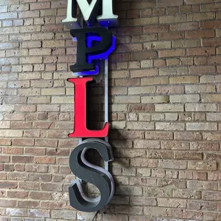 a brick wall with a sign that says love