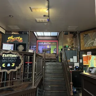 a staircase leading up to a bar
