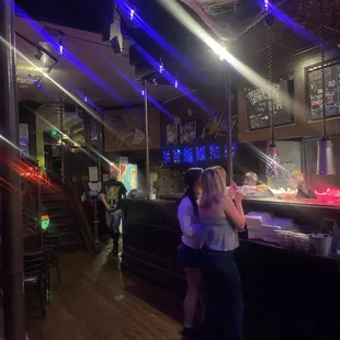 a woman and a man in a bar