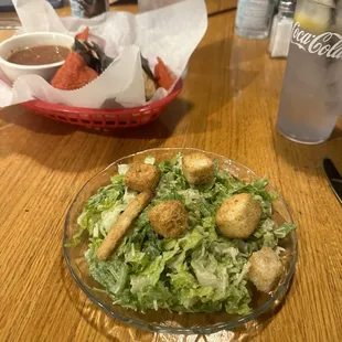 Caesar salad, chips and salsa.