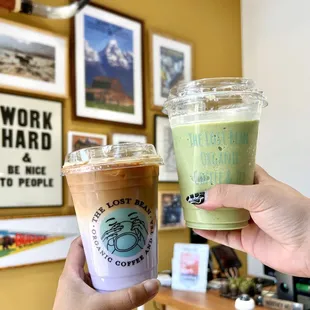 a hand holding a cup of coffee