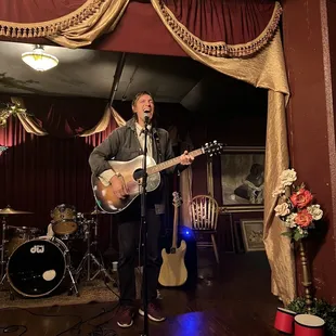 a man playing a guitar