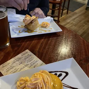 The one up close is the "s'more" and the one across the picture leaning over is "the apple Dutch" more like cornbread though