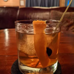 a drink in a glass on a table