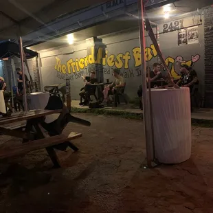 a group of people sitting at a picnic table