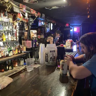 a woman sitting at a bar