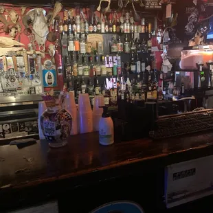 a bar filled with bottles of alcohol