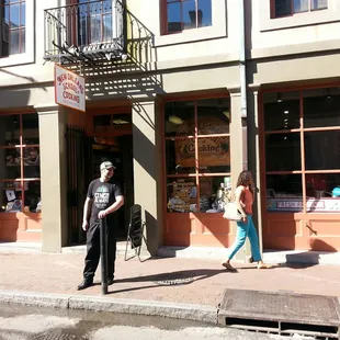 a man and a woman walking down the street