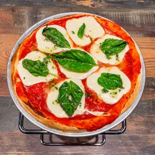 a pizza with mozzarella and basil