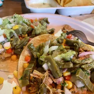 a plate of tacos and chips