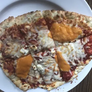 a pizza with cheese and sauce on it