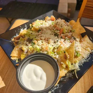 Nachos with sour cream on the side