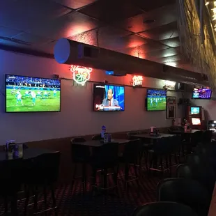 a sports bar with multiple televisions