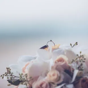 Simple Solitaire diamond ring and bridal bouquet