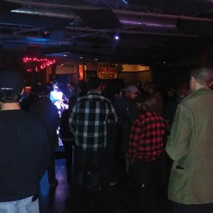 a group of people standing in a room